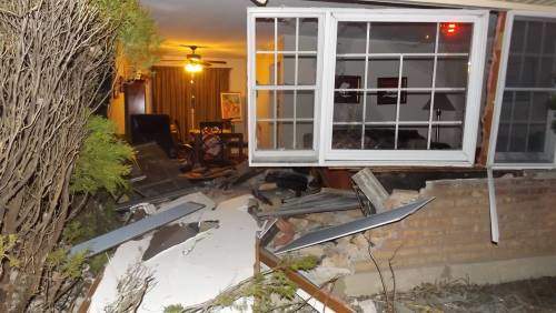 car drives into home on Westgate Drive