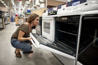 woman viewing oven