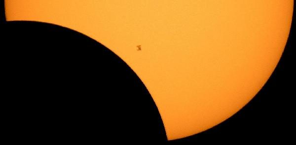 Silhouette of the International Space Station before the sun during the Great American Eclipse of 2017