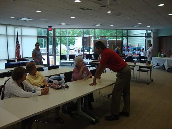 Representative DeLuca talking with local residents about the I-Cash Program, fraud protection, and more senior services