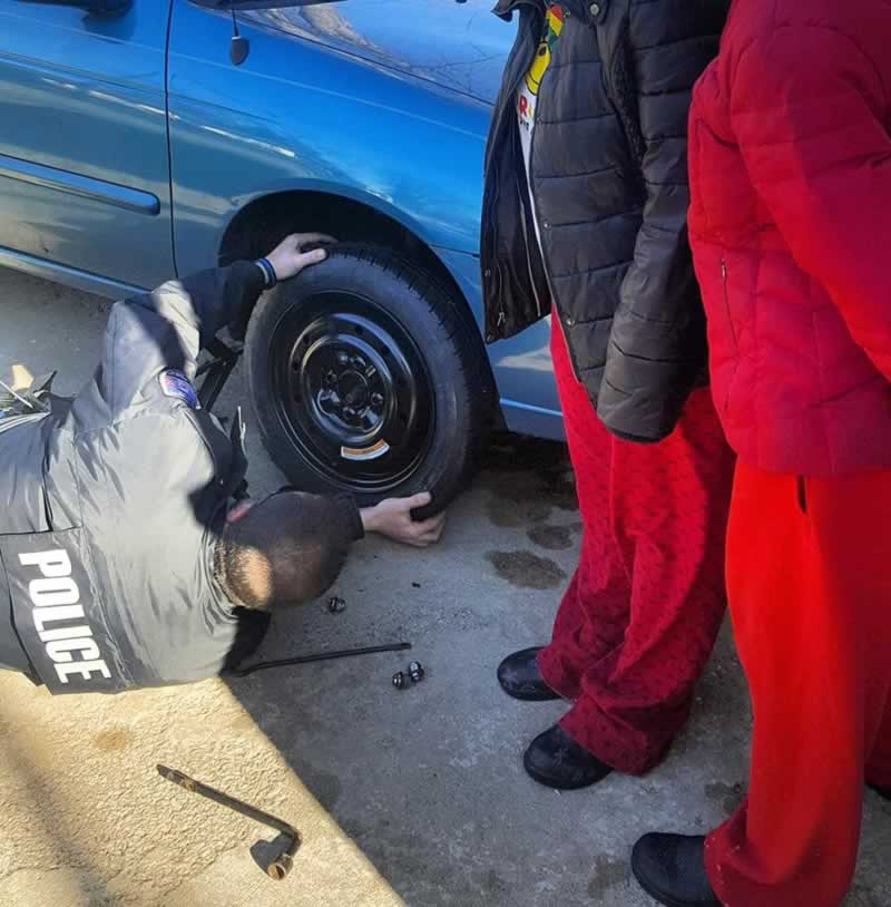 officer helps motorist change a tire, pfpd, arrest report