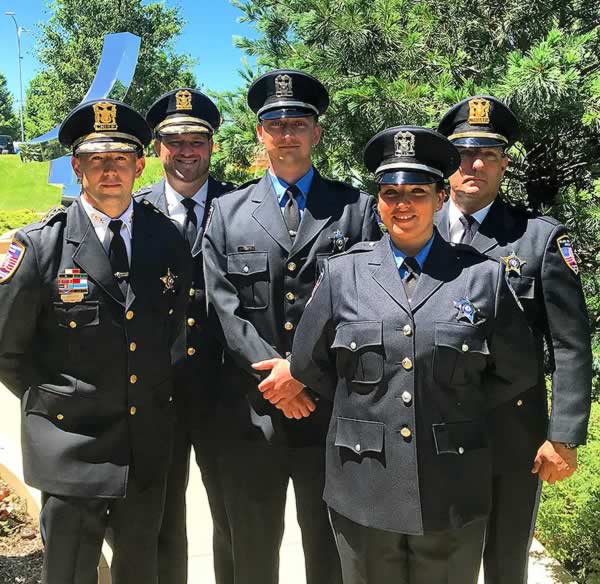 Police Chief Christopher Mannino (l to r), Deputy Chief Brian Rzyski, police recruits Officer Jim Johnson, Officer Jennifer Keith, Commander Michael Baugh