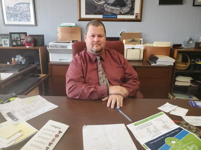 Village Manager Tom Mick at his desk