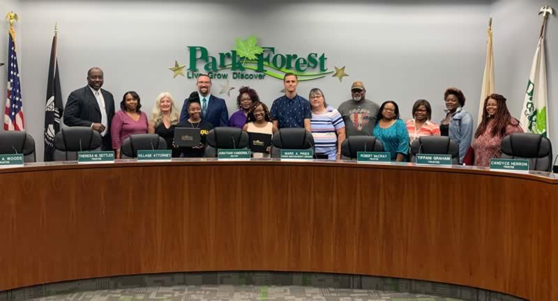 Park Forest scholarship recipients and families pose with Park Forest board members.
