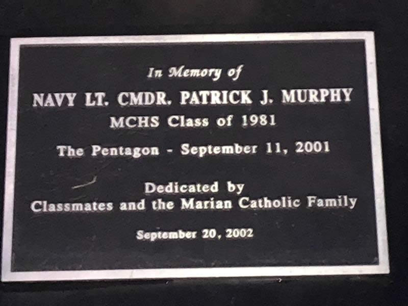 The plaque honoring Navy Lt. Cmdr. Patrick J. Murphy, Marian Catholic class of 1981, is lit Friday night. Lt. Cmdr. Murphy was killed in The Pentagon on September 11, 2011.