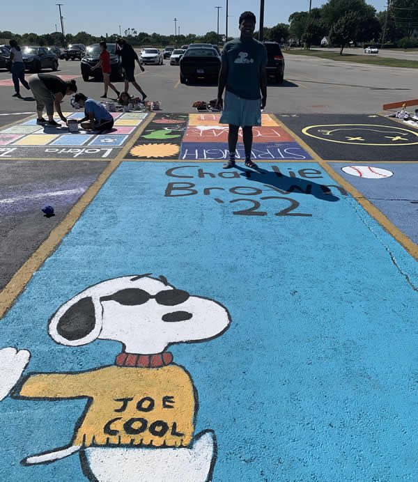 Marian Catholic senior Charlie Brown shows off his personalized "Joe Cool" parking spot.