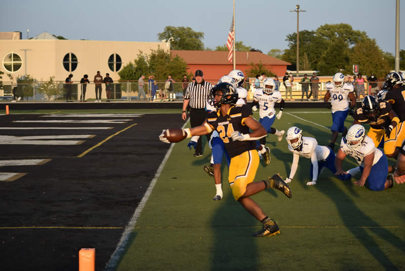 Randall Nauden reaches to score against Bloom Township