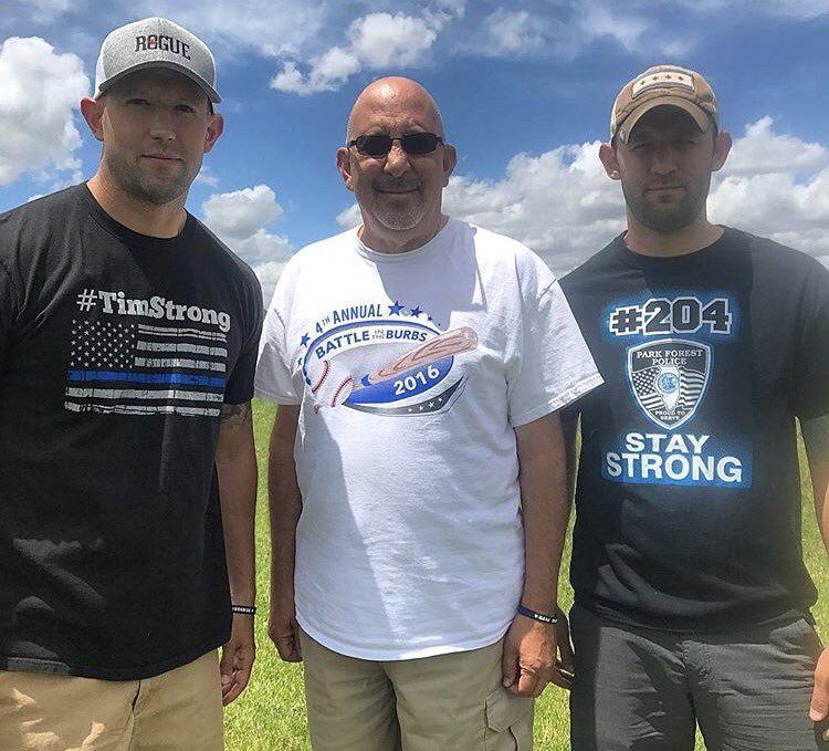 Two sons with father in outdoor setting