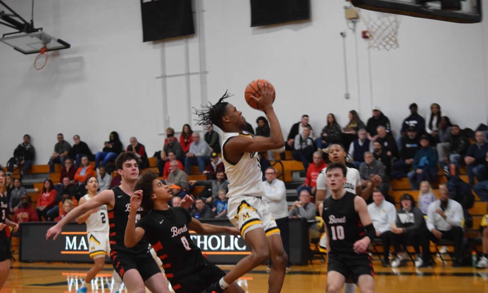 Quentin Jones puts up a successful shot against Benet