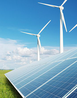 picture of wind energy towers next to a solar panel array