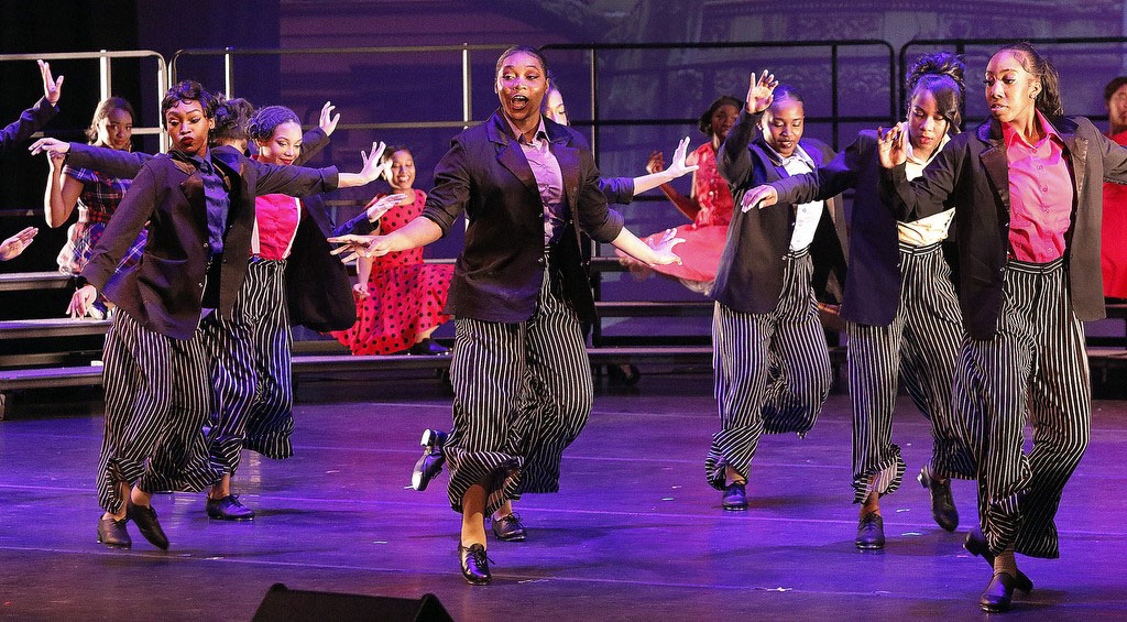 dancers on stage performing a Harlem Tap routine