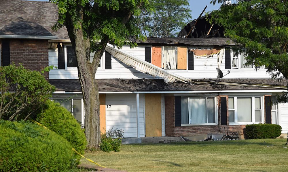 A caved roof now tops the remains of the building where the fire struck.
