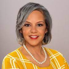 photo of woman wearing yellow dress