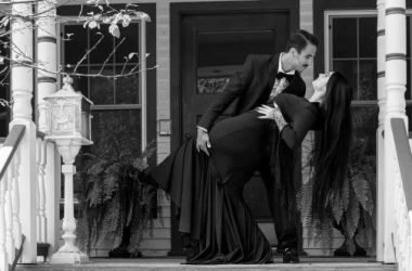 Morticia (Allison McReynolds) and Gomez Addams (Xavier Barham) do a tango on their porch. The musical The Addams Family runs at The Drama Group from October 6 to 15.