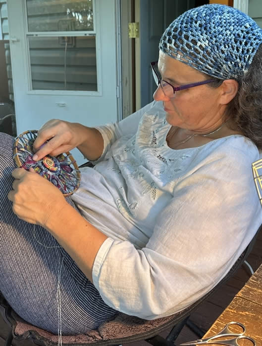 Artist Kristi Yapp works on her free-form crochet.
