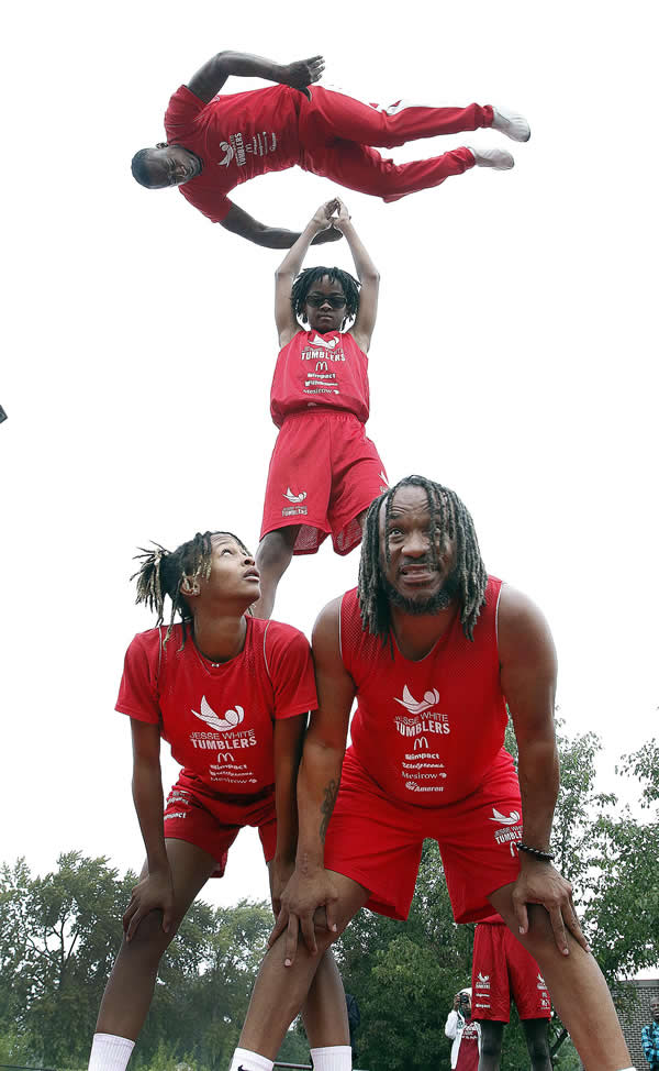 Illinois School eighth grader Trenton Jordan is a member of the Jesse White Tumblers and had a chance to display his talents for his classmates.