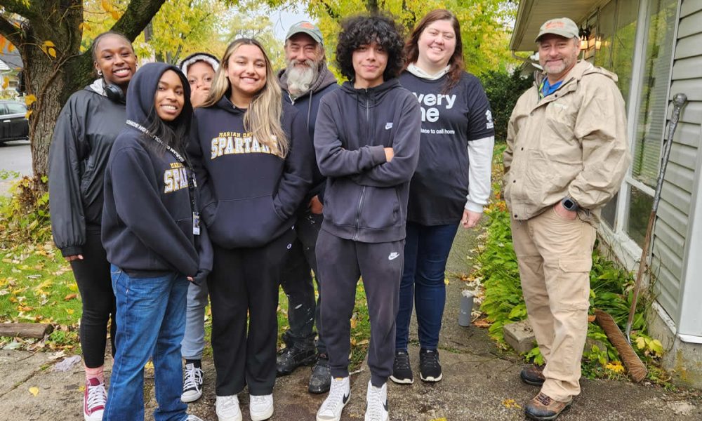 Habitat for Humanity workers and Marian Catholic students team up for a Day of Service.