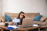 woman stressed over bills, utility bill