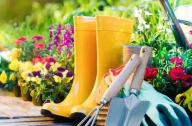 An April Shower of events, a pair of boots, gloves, and gardening tools on wooden planks