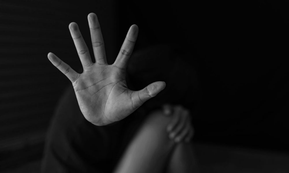 woman's hand signaling stop, Choking incident