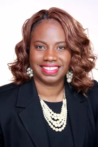mindfulness training from Felicia Marie Houston, here wearing a black suit